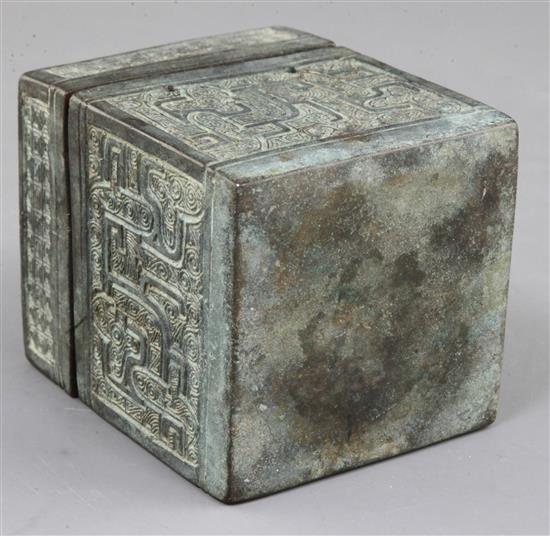 A Chinese archaic bronze square box and cover, Eastern Zhou dynasty, 6th-5th century B.C., 9.3cm high